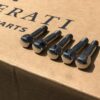 Five as new Maserati wheel studs with part number 803384